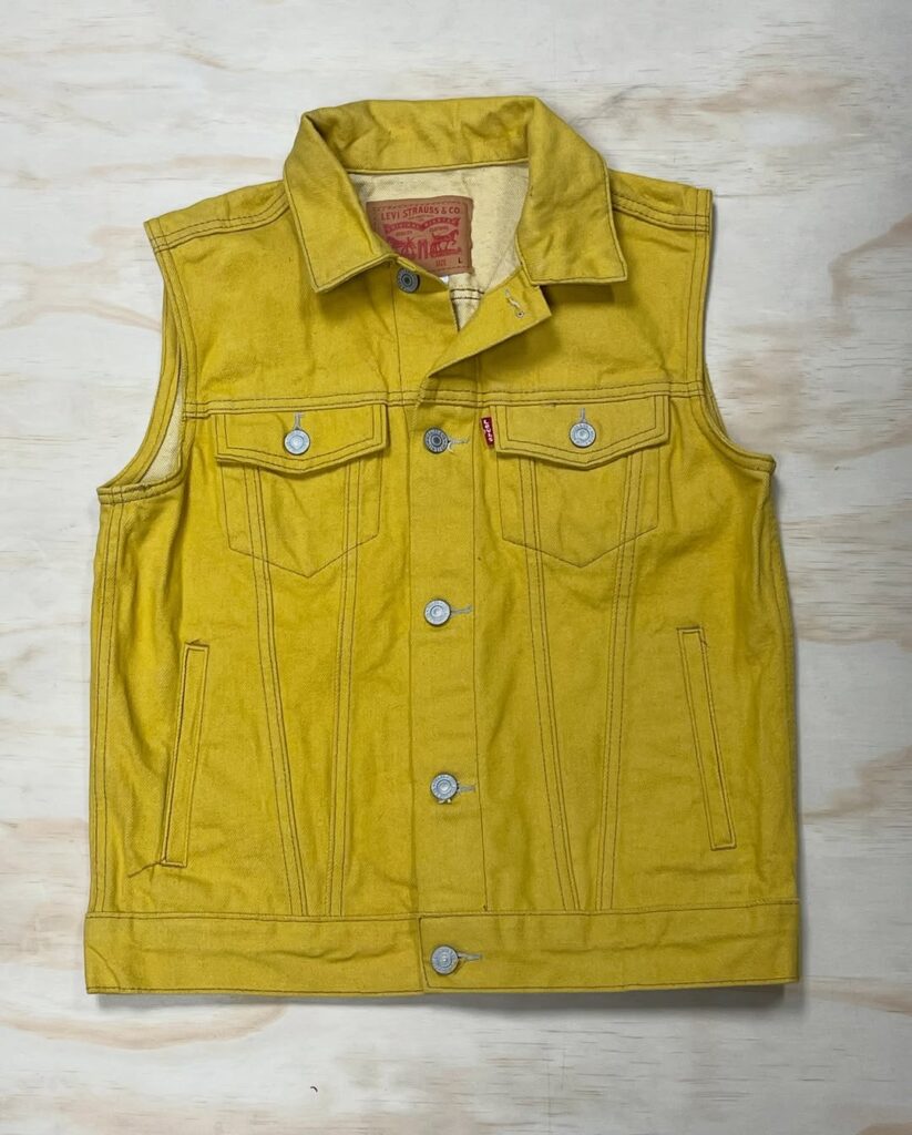 Yellow Levi's sleeveless denim vest displayed at Ontario Vintage Market
