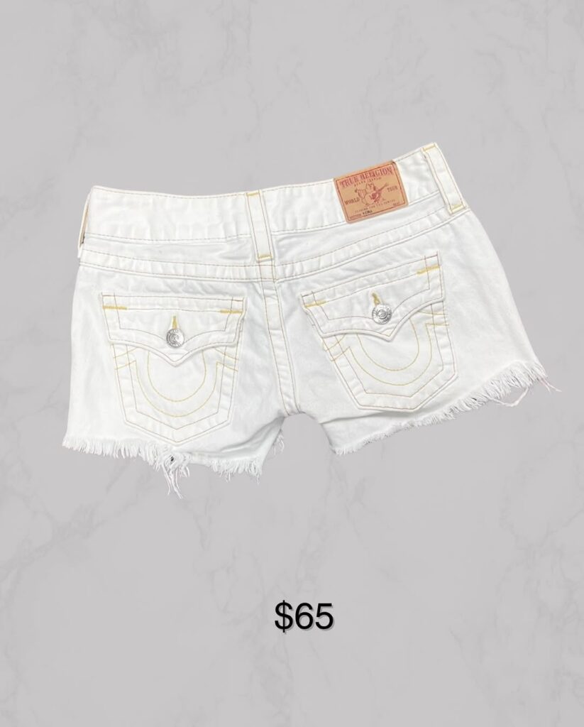 White True Religion frayed shorts with yellow stitching – $65