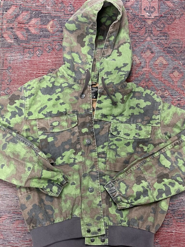 Oversized green and brown camo hoodie jacket with buttons and drawstring hood